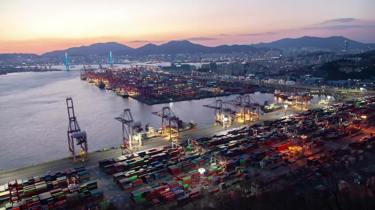 Aerial view of a container port at dusk